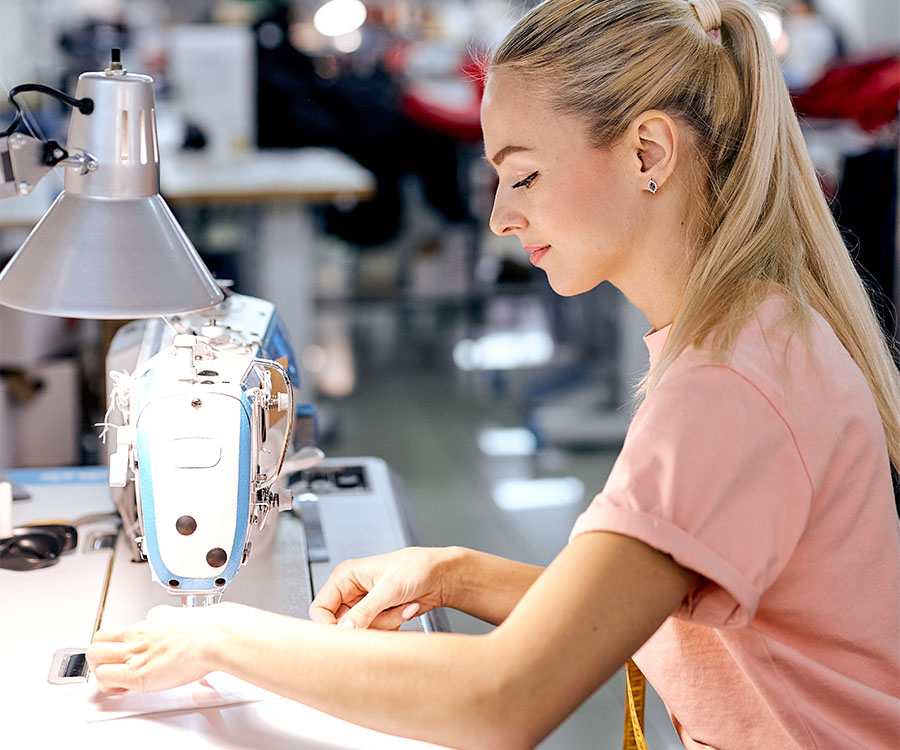 a lady sewing and stitching